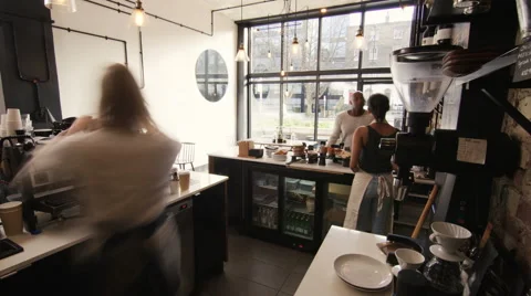 4K Time lapse of busy staff members serving customers in city coffee shop Stock Footage