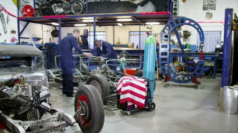 4K Time lapse busy team of mechanics working on classic cars in auto repair shop 스톡 동영상 49687184