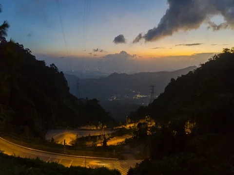 4K Time Lapse car moving downhill with a cloud movement during sunset Video stock 72354479