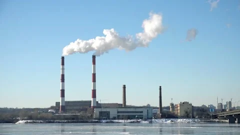 4K Time lapse of Chimneys Power Plant on the river bank. Air Pollution Concept Video stock 99749986