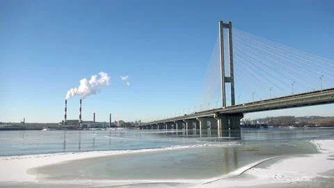 4K Time lapse of Chimneys Power Plant and Bridge. Air Pollution Concept Stock Footage 99749989