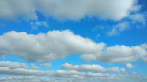 4k Time lapse clip of white fluffy clouds over blue sky Stock Footage 97920476