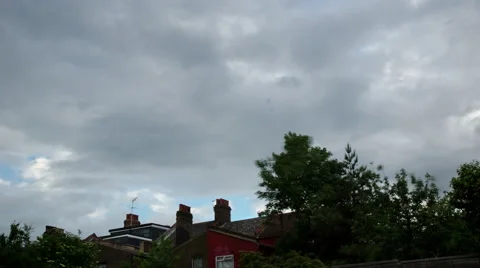 4k Time Lapse clouds and trees in a suburb of London Vídeo Stock 60257537