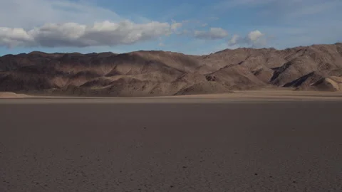 4K Time lapse of clouds in blue sky at the Desert Racetrack in Death Valley Stock Footage 147518926
