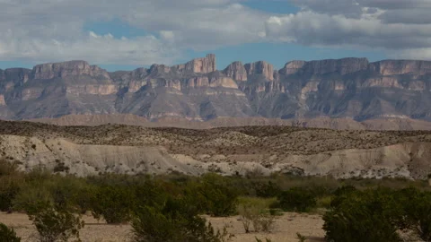 4K Time lapse of clouds in blue sky casting shadows on Big Bend Park landscape Stock Footage 166541120