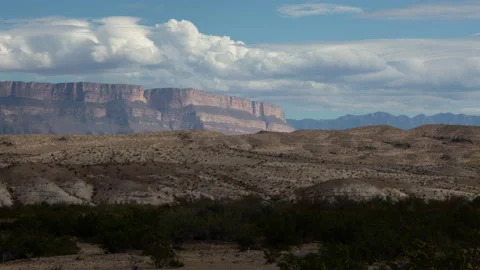 4K Time lapse of clouds in blue sky over the Sierra del Carmen in Big Bend Stock Footage 166541326
