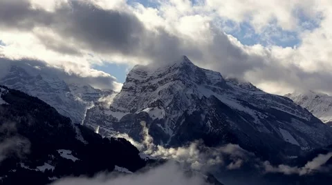 4k time lapse of clouds mass rolling over Tibet snow-Covered mountains,Danggula Stock Footage 64420135