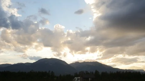 4k Time Lapse of Clouds Moving Over Mountains at Sunset Video stock 96345331