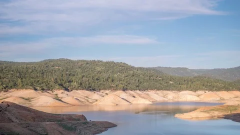 4K Time Lapse of Clouds Passing Over A Lake Stock Footage 69777820