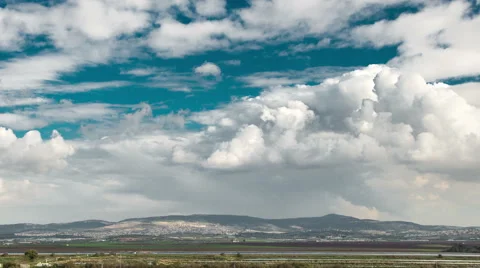 4k Time lapse of clouds in pure sky over the Galilee fields, Israel Vídeo Stock 46961875