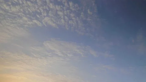 4K Time lapse of Clouds -  Rays and Glare of the Sun through the Clouds. Stock Footage 144212655