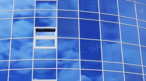 4K Time Lapse of Clouds Refelected in Modern Office Building Stock Footage 63043050