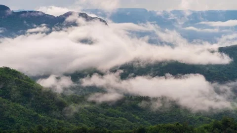 4K Time lapse clouds as the sky sunrise fog form misty nature ridge mountains  Stock Footage 148154930