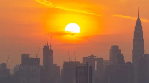 4K Time lapse cloudy and haze sunset over downtown Kuala Lumpur, Malaysia. Zoom Stock Footage 113975952