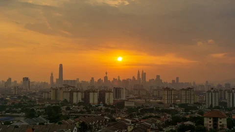 4K Time lapse cloudy and haze sunset over downtown Kuala Lumpur, Malaysia. Stock Footage 114074482