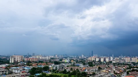 4K Time lapse of cloudy monsoon over down town Kuala Lumpur, Malaysia. Zoom In. Stock Footage 118290979