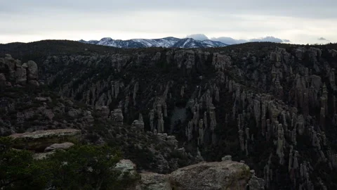 4K Time lapse of cloudy, snowy mountains and pinnacles in Chiricahua monument Stock Footage 241273197