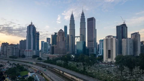 4K Time lapse of cloudy sunrise over downtown Kuala Lumpur, Malaysia. Stock Footage 90799862