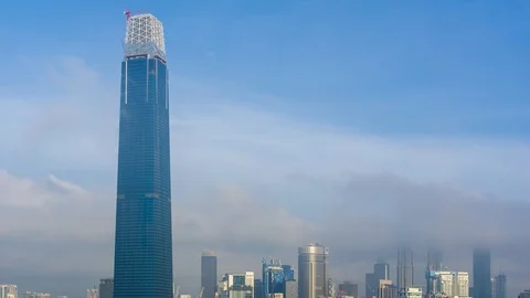 4K Time lapse of cloudy sunrise over Exchange 106 tower. Stock Footage 97457632