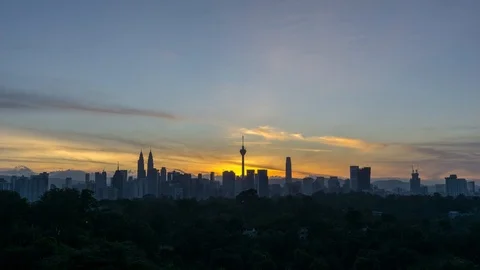 4K Time lapse of cloudy sunrise over downtown Kuala Lumpur, Malaysia. Stock Footage 101496328