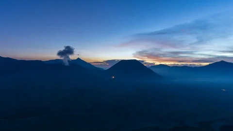 4K Time lapse of cloudy sunset over mountain range at Mount Bromo Stock Footage 88988030