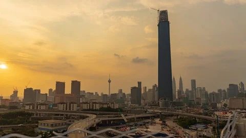 4K Time lapse of cloudy sunset over downtown Kuala Lumpur, Malaysia. Zoom In Stock Footage 94137470
