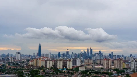 4K Time lapse of cloudy sunset over downtown Kuala Lumpur. Zoom In Stock Footage 97904655