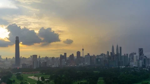 4K Time lapse of cloudy sunset over downtown Kuala Lumpur. Zoom In 스톡 동영상 98159260