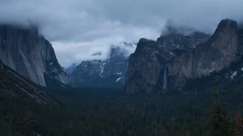 4K time lapse of dark stormy clouds swirling above Bridalveil Fall in Yosemite Stock Footage 148341271