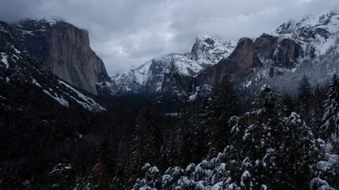 4K Time lapse of dark sunset and dusk clouds and a snowy Yosemite Valley Video stock 145956824