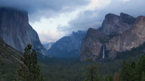 4K time lapse of dark sunset clouds and Bridalveil Fall waterfall in Yosemite Stock Footage 146348780