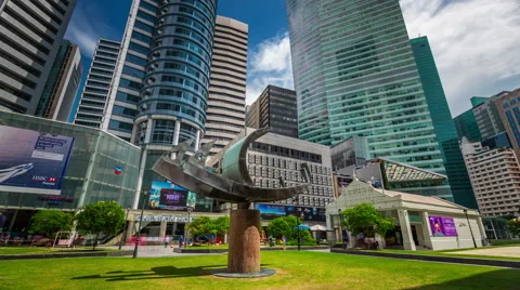 4k time lapse of day light city park with fish monument in singapore Vídeos de archivo 46554126
