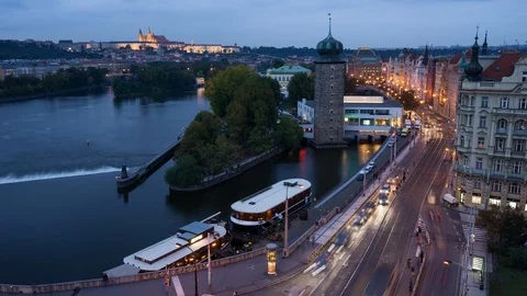 4K Time lapse day to night of Prague riverside shot from Dancing house Stock Footage 97956805