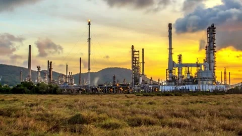 4K time-lapse day to night of oil refinery plant with storage tank refinery.. Stock Footage 256671474