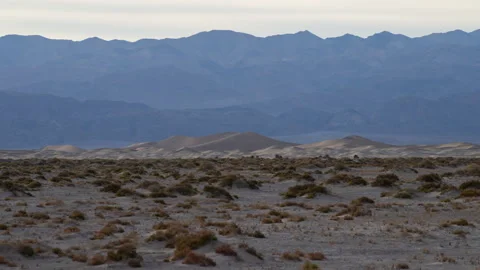 4K Time lapse of the distant Mesquite sand dunes in a cloudy Death Valley Stock Footage 260665147