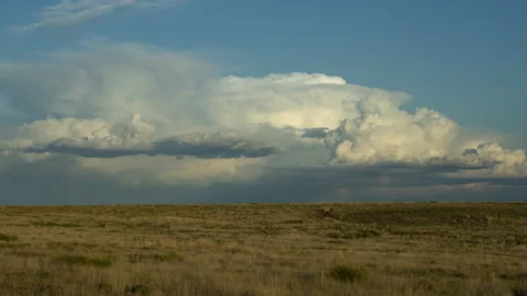 4K Time lapse of a distant thunderstorm and tan prairie in New Mexico in Spring Stock Footage 158332224