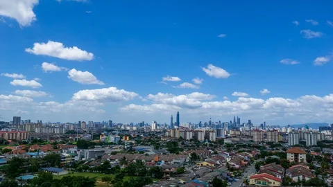 4K Time lapse of dramatic and fluffy moving clouds over Kuala Lumpur, Malaysia. Stock Footage 122277753
