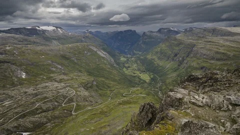 4K Time-lapse of Dramatic Clouds and Mountain Road Above Geiranger (zoom). Stock Footage 101054162