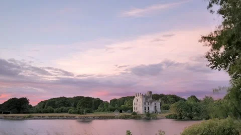 4k time lapse, dramatic cloudy sunset at Menlo castle by Corrib river at Galway Stock Footage 279029146