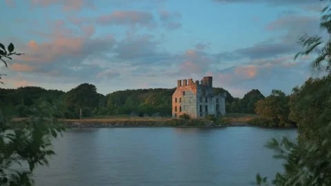 4k time lapse, dramatic cloudy sunset at Menlo castle by Corrib river at Galway Stock Footage 279348297