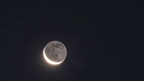4k time lapse of earthshine at dawn on a waning crescent moon Stock Footage 141260891