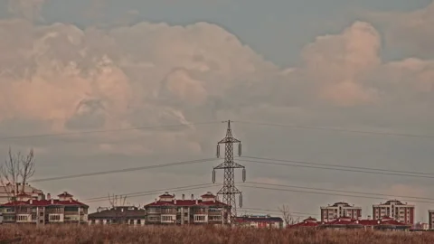 4K Time Lapse Electricity Pylon Power Lines Clouds Moving Residential Area Stock Footage 322105531