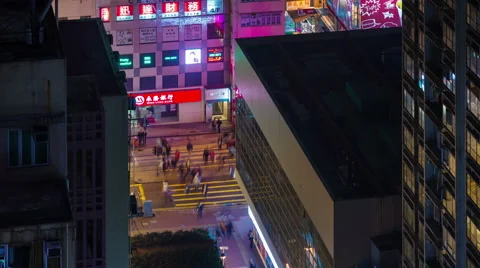 4k time lapse of extremely busy traffic crossroad from roof top in hong kong Stock Footage 46545475
