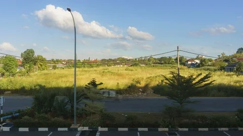 4k time lapse of fast moving clouds over the town at Kangar, Perlis Stock Footage 127454633