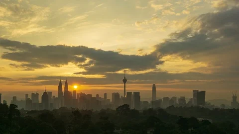 4K Time lapse of glory sunrise over downtown Kuala Lumpur. Zoom In Stock Footage 96984876