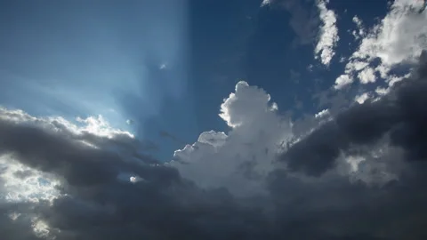 4K time lapse of a growing summer storm backlit by late afternoon sunlight Stock Footage 204863450