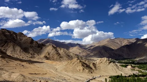 4K Time lapse in high-mountain region with clouds rolling by over sky Stock-Footage 110734822