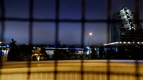 4K TIME LAPSE OF HIGHWAY AND SKY THROUGH WIRE FENCE Stock Footage 131277257
