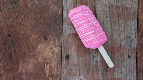 4K Time Lapse of ice cream melting on old wood, Top view Stock Footage 63071310