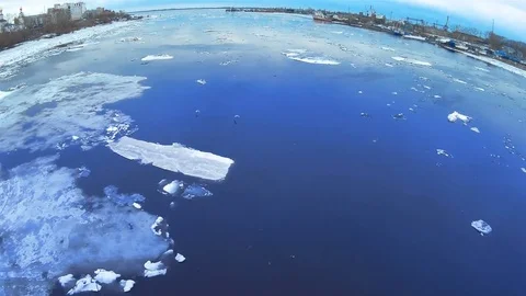 4k Time-lapse Ice drift on the river. In the spring the ice floats on the river. Stock Footage 75618906